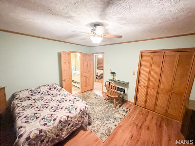 1 Timber Ln, Salem, MO 65560 - bedroom with wood finished floors, ornamental molding, a closet, ceiling fan, and a textured ceiling