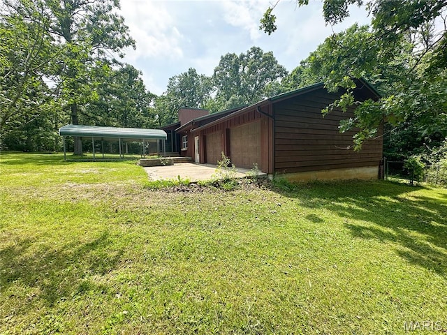 1 Timber Ln, Salem, MO 65560 - view of grassy yard with an attached garage and driveway