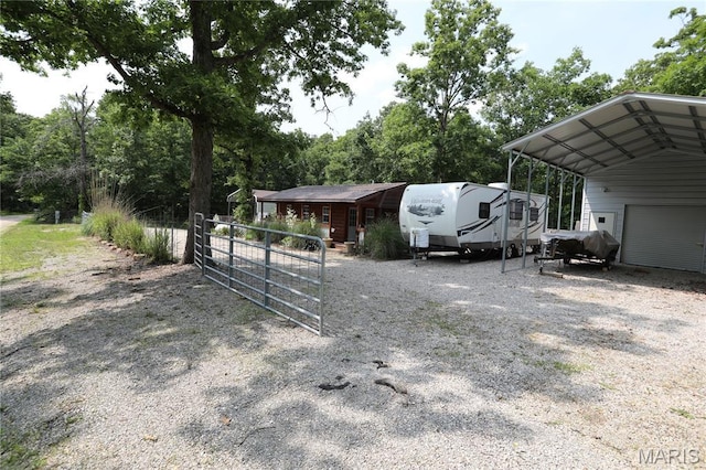 80 Lakeview Dr, Wappapello, MO 63966 - exterior space with driveway, a garage, and view of wooded area