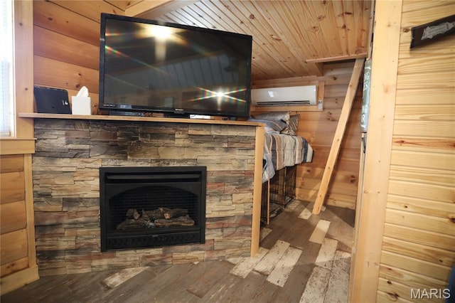 80 Lakeview Dr, Wappapello, MO 63966 - detailed view of wood finished floors, wood walls, a wall mounted AC, and a stone fireplace