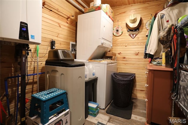 80 Lakeview Dr, Wappapello, MO 63966 - laundry room with stacked washer / drying machine, wood walls, and tankless water heater