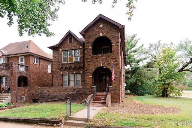7360 Dartmouth Ave, University City, MO 63130 - view of front facade with a front lawn, brick siding, and cooling unit