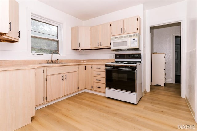 7360 Dartmouth Ave, University City, MO 63130 - kitchen with white appliances, light wood-style floors, light countertops, and light brown cabinetry