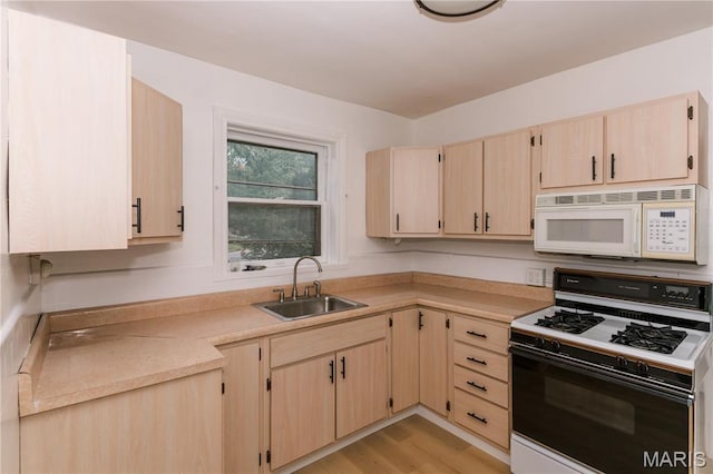 7360 Dartmouth Ave, University City, MO 63130 - kitchen featuring white appliances, light brown cabinetry, light countertops, and light wood-style floors