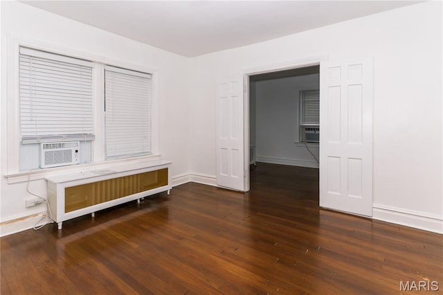 7360 Dartmouth Ave, University City, MO 63130 - empty room featuring radiator, wood finished floors, and cooling unit