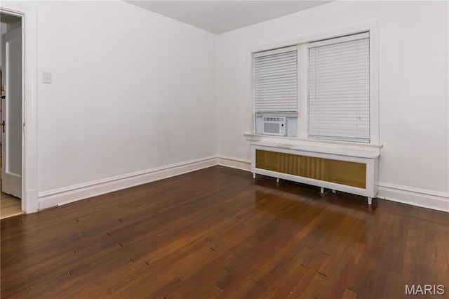 7360 Dartmouth Ave, University City, MO 63130 - empty room featuring radiator heating unit, wood finished floors, and cooling unit