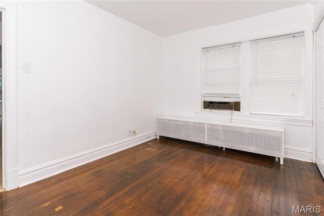 7360 Dartmouth Ave, University City, MO 63130 - empty room featuring radiator and wood-type flooring