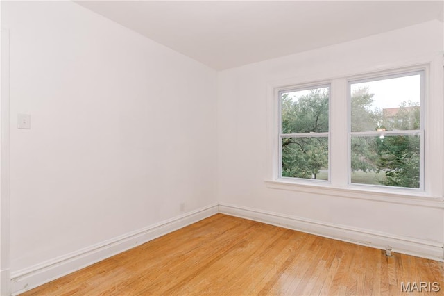 7360 Dartmouth Ave, University City, MO 63130 - spare room featuring baseboards and light wood finished floors