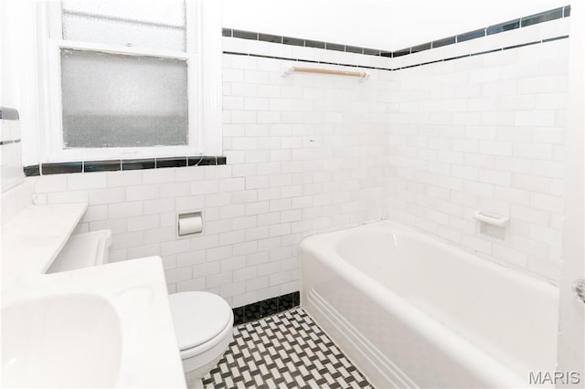 7360 Dartmouth Ave, University City, MO 63130 - bathroom with tile walls, vanity, and shower / washtub combination