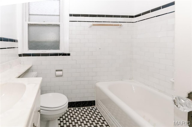 7360 Dartmouth Ave, University City, MO 63130 - full bathroom featuring tile walls, a tub to relax in, vanity, and wainscoting