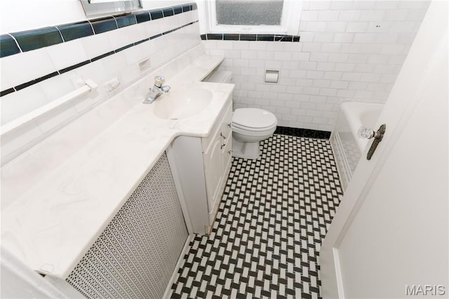 7360 Dartmouth Ave, University City, MO 63130 - bathroom featuring tile walls, vanity, a bath, tile patterned floors, and a shower