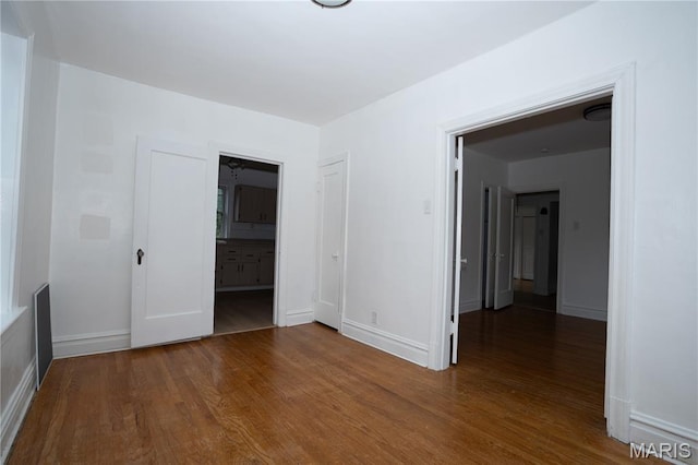 7360 Dartmouth Ave, University City, MO 63130 - empty room featuring wood finished floors and baseboards