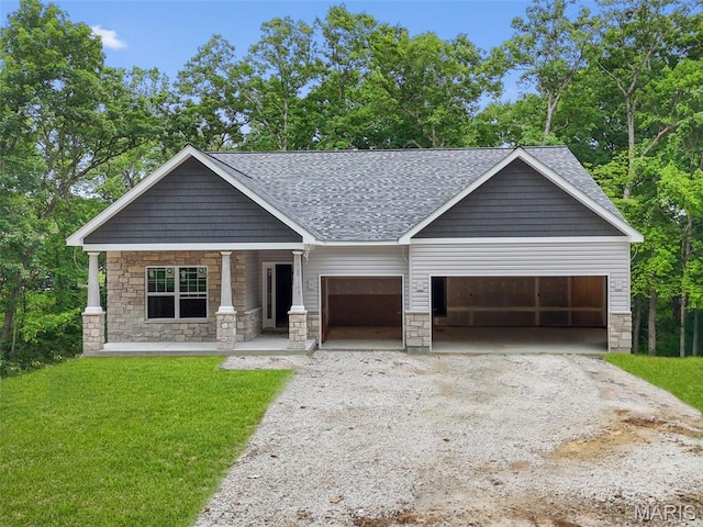 31634 Dogwood Ln, Foristell, MO 63348 - view of front of property featuring stone siding, a porch, a garage, driveway, and a shingled roof