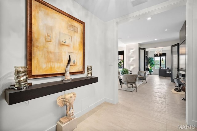 150 Carondelet Plz Unit 702, Clayton, MO 63105 - hallway featuring a chandelier and recessed lighting