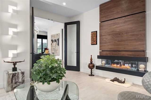 150 Carondelet Plz Unit 702, Clayton, MO 63105 - living area featuring a multi sided fireplace and recessed lighting