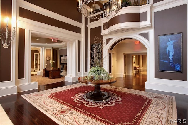 150 Carondelet Plz Unit 702, Clayton, MO 63105 - building lobby featuring crown molding and a towering ceiling