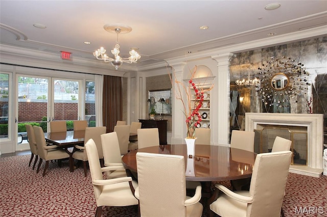 150 Carondelet Plz Unit 702, Clayton, MO 63105 - carpeted dining room featuring a chandelier, crown molding, and ornate columns