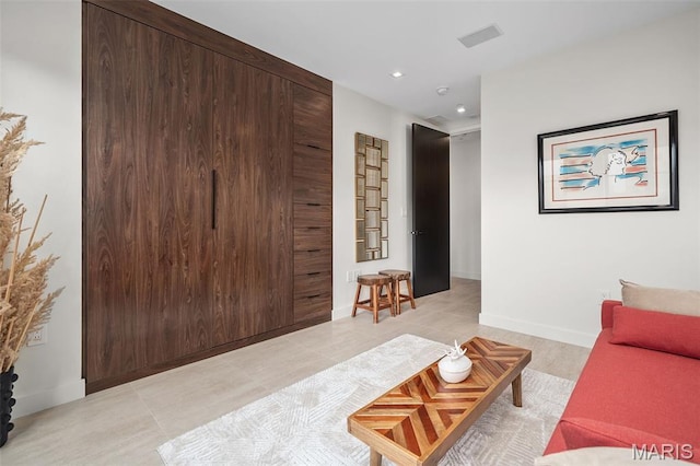 150 Carondelet Plz Unit 702, Clayton, MO 63105 - living room with recessed lighting and light tile patterned floors