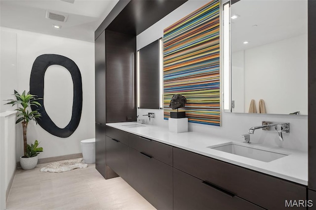 150 Carondelet Plz Unit 702, Clayton, MO 63105 - bathroom with double vanity and recessed lighting