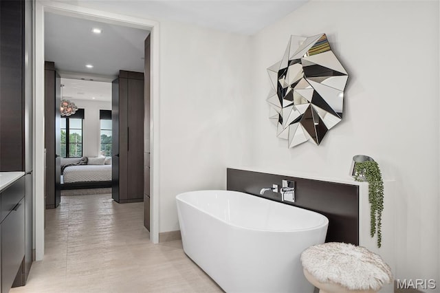 150 Carondelet Plz Unit 702, Clayton, MO 63105 - full bath featuring a freestanding bath, ensuite bathroom, recessed lighting, and vanity