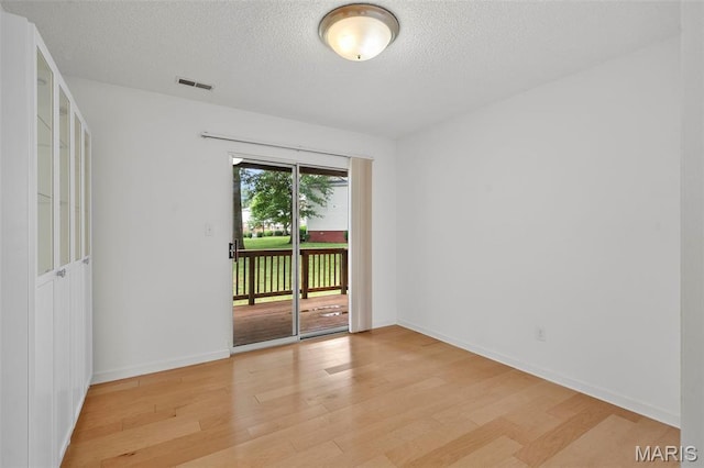 9177 Robin Ct, Brentwood, MO 63144 - spare room with light wood finished floors, a textured ceiling, and baseboards