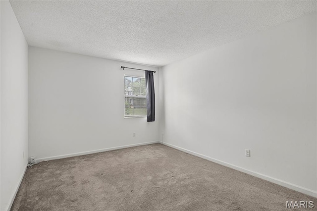 9177 Robin Ct, Brentwood, MO 63144 - carpeted empty room featuring a textured ceiling and baseboards