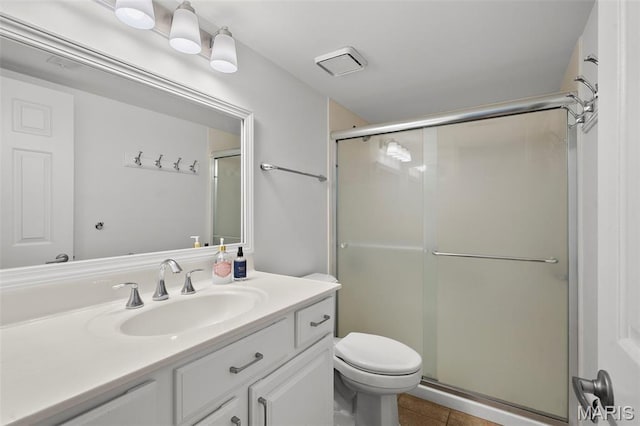 9177 Robin Ct, Brentwood, MO 63144 - full bathroom featuring vanity, a shower stall, toilet, and tile patterned flooring