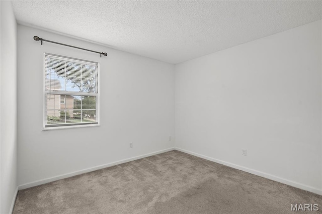 9177 Robin Ct, Brentwood, MO 63144 - empty room featuring carpet, a textured ceiling, and baseboards