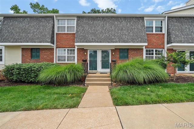 9177 Robin Ct, Brentwood, MO 63144 - view of front of home featuring roof with shingles, brick siding, mansard roof, and a front lawn
