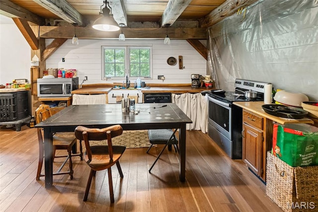 5423 Saxtown Rd, Millstadt, IL 62260 - kitchen featuring stainless steel appliances, hardwood / wood-style flooring, wood walls, wood ceiling with exposed beams, and brown cabinets