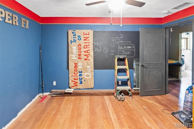 5423 Saxtown Rd, Millstadt, IL 62260 - unfurnished bedroom featuring wood finished floors, baseboards, and a ceiling fan