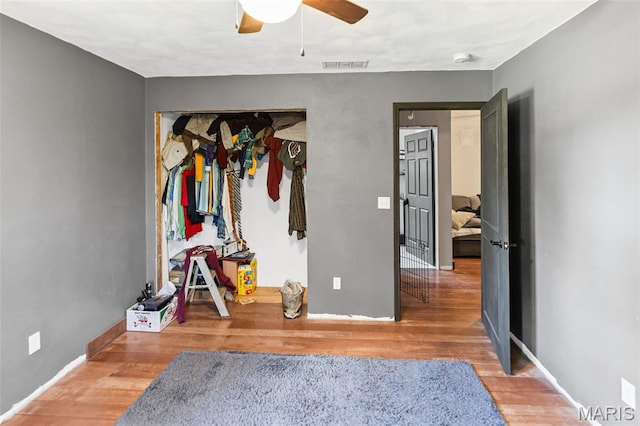 5423 Saxtown Rd, Millstadt, IL 62260 - bedroom featuring wood finished floors, baseboards, a closet, and a ceiling fan
