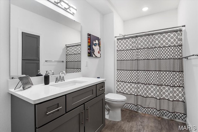 1547 Frost Lndg, Columbia, IL 62236 - full bathroom with toilet, vanity, wood finished floors, and curtained shower