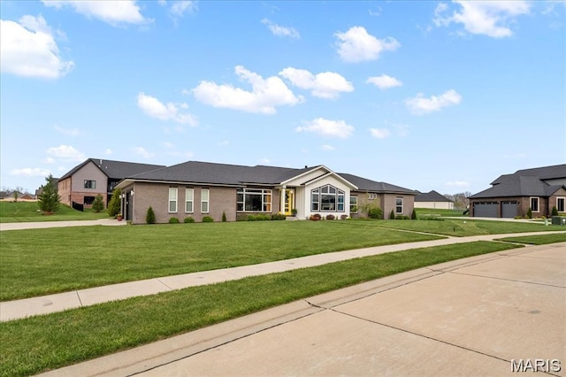1547 Frost Lndg, Columbia, IL 62236 - view of front facade featuring a front lawn, driveway, and brick siding