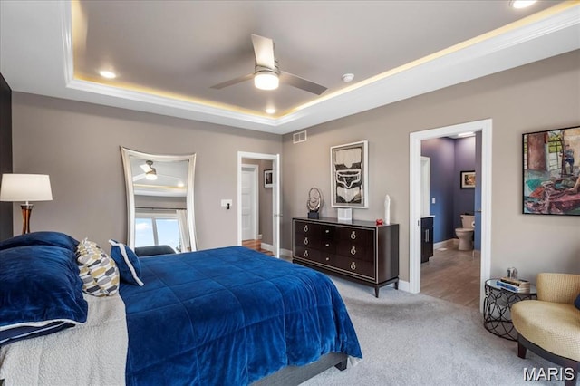 1547 Frost Lndg, Columbia, IL 62236 - carpeted bedroom featuring a tray ceiling, ensuite bath, and ceiling fan
