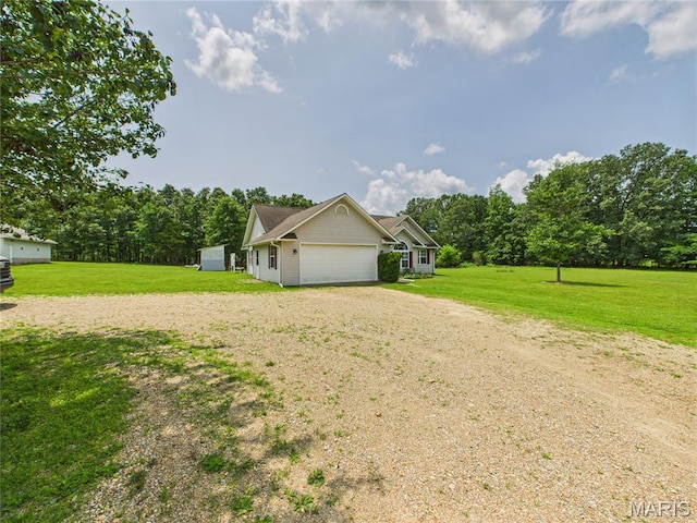 4862 State Highway 142e, Doniphan, MO 63935 - view of side of property featuring dirt driveway, a garage, and a yard