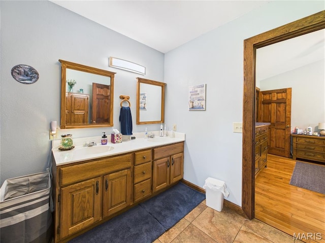 4862 State Highway 142e, Doniphan, MO 63935 - bathroom featuring double vanity and baseboards