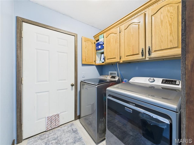 4862 State Highway 142e, Doniphan, MO 63935 - laundry area with cabinet space and washing machine and clothes dryer