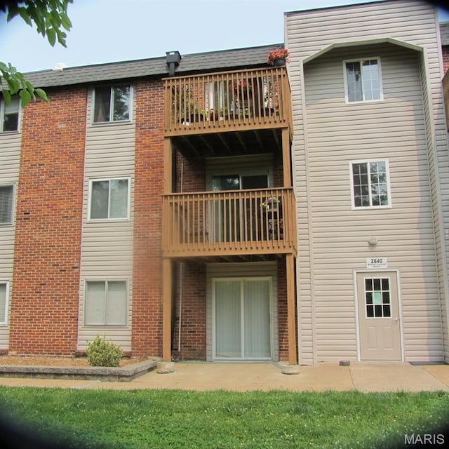 2840 Blackforest Dr Unit B, Saint Louis, MO 63129 - rear view of property with brick siding, a balcony, and roof with shingles