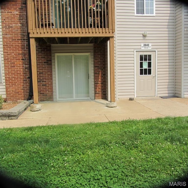2840 Blackforest Dr Unit B, Saint Louis, MO 63129 - doorway to property featuring a balcony and brick siding