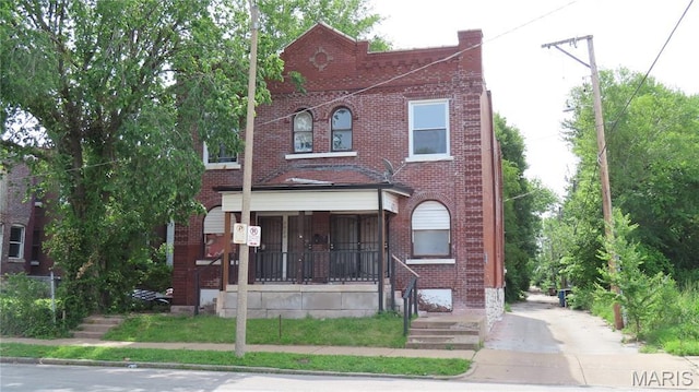 3018 N Vandeventer, Saint Louis, MO 63107 - view of property with brick siding, a porch, and concrete driveway