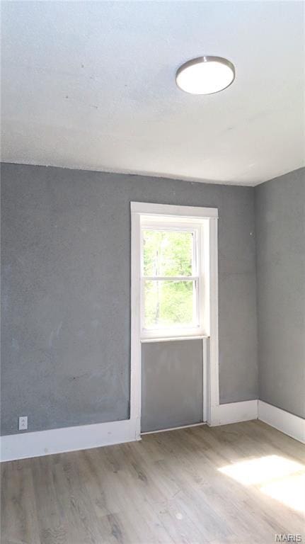 3018 N Vandeventer, Saint Louis, MO 63107 - empty room featuring wood finished floors and baseboards