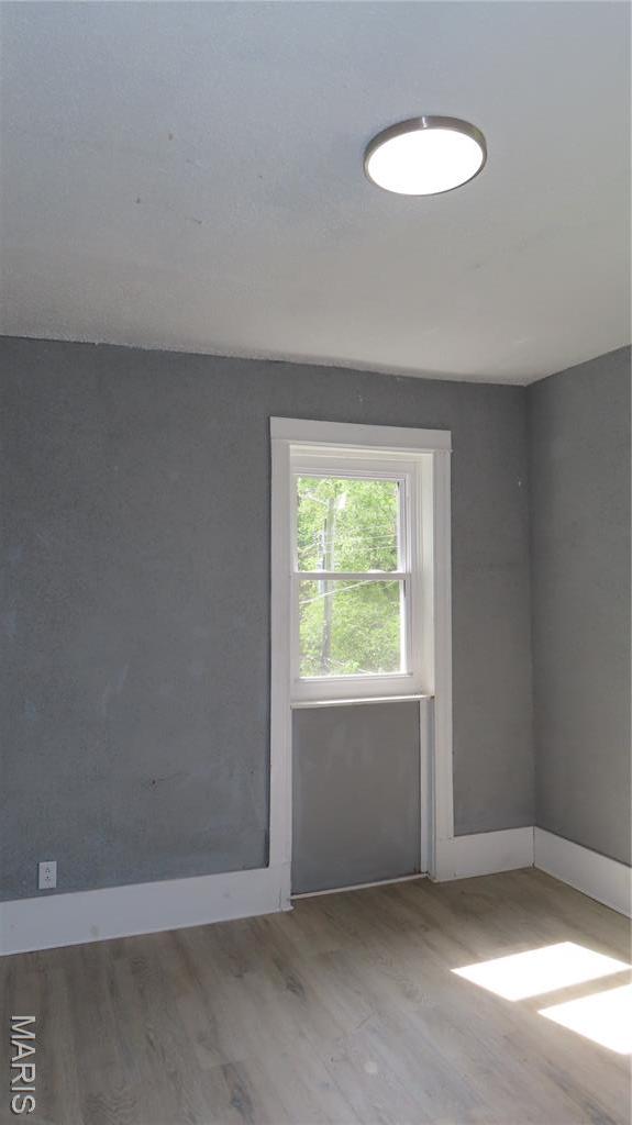 3018 N Vandeventer, Saint Louis, MO 63107 - spare room featuring wood finished floors and baseboards