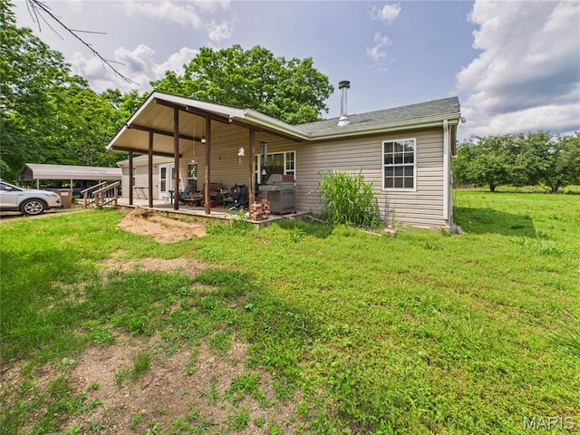 284 Wayne 349, Piedmont, MO 63957 - rear view of house featuring a yard and a patio area