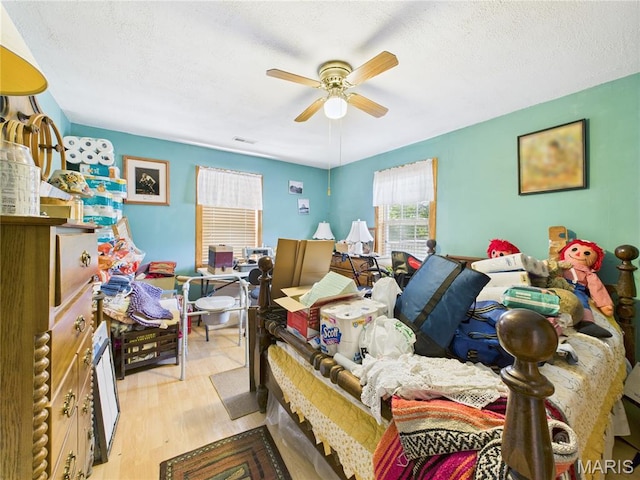 284 Wayne 349, Piedmont, MO 63957 - bedroom featuring wood finished floors, a textured ceiling, and ceiling fan
