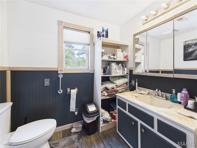 284 Wayne 349, Piedmont, MO 63957 - bathroom with toilet, a wainscoted wall, wood finished floors, and vanity