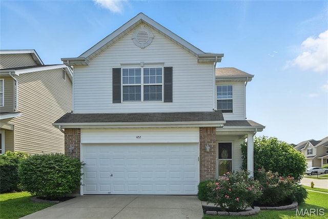 457 Spring Trce, Ofallon, MO 63368 - traditional-style house with driveway, a garage, and brick siding