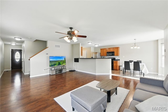 457 Spring Trce, Ofallon, MO 63368 - living room with a chandelier, dark wood-type flooring, and ceiling fan