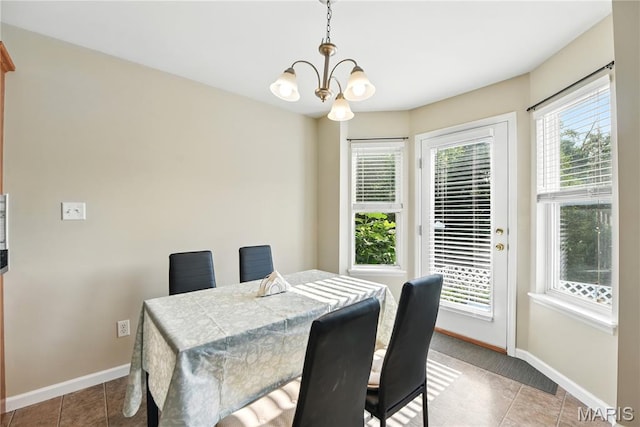 457 Spring Trce, Ofallon, MO 63368 - dining space featuring a chandelier and tile patterned flooring