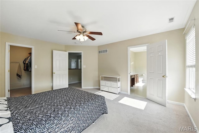 457 Spring Trce, Ofallon, MO 63368 - bedroom featuring carpet flooring, a walk in closet, ensuite bath, and ceiling fan